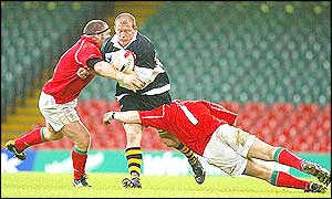 Adrian Garvey storms through the Welsh defence