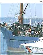 The Turkish coastguards intercept a boat with suspected illegal immigrants on board in 2001