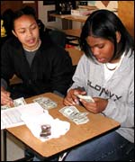 Students count their takings from the stalls