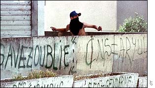 Demonstrator throws stone at police in Tizi Ouzou