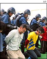 Japanese coastguards practice dealing with hooligans