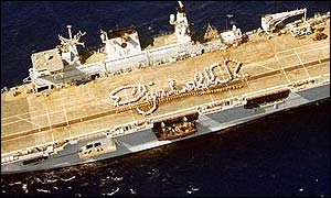 The ship's company on HMS Ocean, the Royal Navy's largest vessel, mark out Elizabeth R on deck