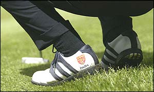 Ian Poulter sports a pair of Arsenal embossed shos at Woburn