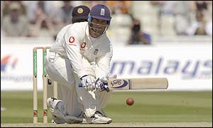 Graham Thorpe of England sweeps the ball to the boundary