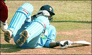 Yuvraj Singh tries to save his wicket by throwing himself at the crease