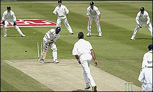 Andrew Caddick of England bowls out Hashan Tillakaratne of Sri Lanka 