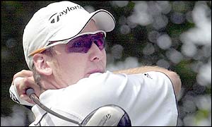 Ian Poulter tees off at the seventh hole