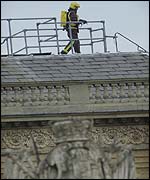 Fire fighter on palace roof