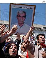 Supporters carry poster of Ahmed Saadat in Gaza