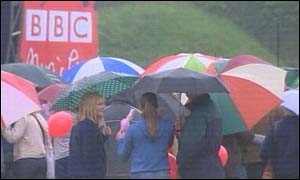Crowds with umbrellas at the BBC Music Live in Cardiff