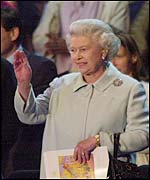 The Queen takes her seat among the crowds