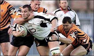 Widnes' Steve McCurrie is tackled by Castleford's Adrian Rainey