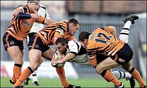 Widnes' Steve McCurrie is felled by the Castleford defence