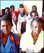 Aids victims waiting for food at the village of Henga 