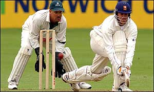 Flower plays a sweep shot watched by wicket-keeper Steve Rhodes