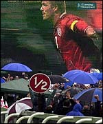 Spectators at Epsom Races watch Beckham celebrate 