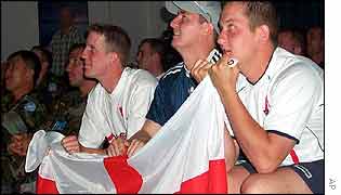British soldiers with the UN force in Nicosia watch the match