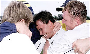 Carter is mobbed by ecstatic team-mates 