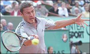 Safin reaches for a forehand
