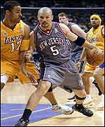 Jason Kidd is guarded by Lakers' Rick Fox