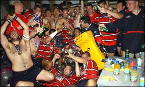 The Gloucester players celebrate victory