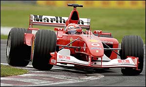 Michael Schumacher's Ferrari rides the kerb at Montreal
