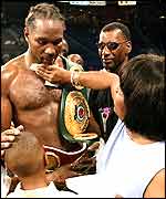 Lennox Lewis has his face wiped by his mother Violet 