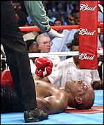 Mike Tyson is counted out by referee Eddie Cotton
