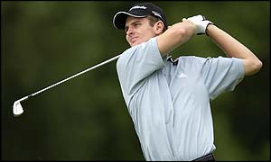 Justin Rose of England hits another good approach to the ninth