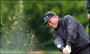 The tricky conditions don't stop Darren Clarke hitting the greens 