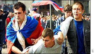 Russian fans restrain a fellow supporter
