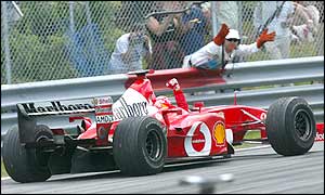 Michael Schumacher celebrates victory in Canada