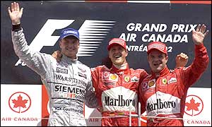 Podium celebrations for Schumacher, Coulthard and Barrichello