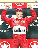 Michael Schumacher delights in his 59th career victory.