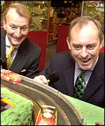 Neil Johnson, chairman, and Frank Martin, chief executive, of Hornby with a Scalextric set