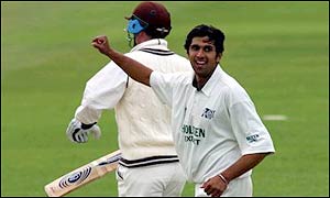 Khan celebrates the wicket of Surrey's Graham Thorpe