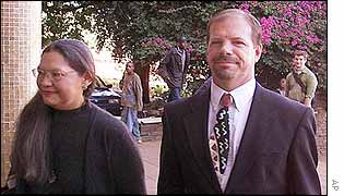 Andrew Meldrum, with his wife, Dolores, arriving at court