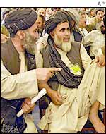 Delegates from Kandahar confer during the loya jirga
