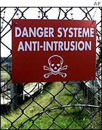 Sign on barbed fences around the Channel Tunnel