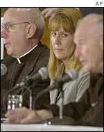 Archbishop Harry J. Flynn (L), Barbara Blaine of Survivors Network of Those Abused by Priests, and Cardinal Theodore McCarrick (R)
