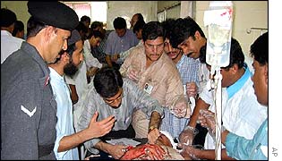 An injured man is attended to in a Karachi hospital 