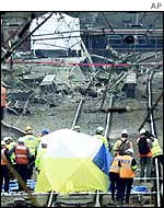 Engineers examine the points