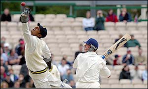 Kumar Sangakkara drops a catch as Alec Stewart looks on 