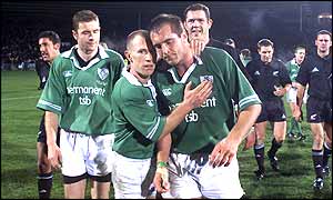 Ireland's weary players leave the field after losing 15-6 to New Zealand