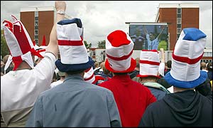 Large crowds watch the big screens outside Old Trafford