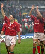 Stephen Jones and Colin Charvis salute the travelling Welsh support