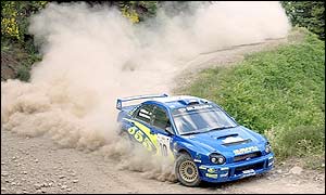 Finland's Tommi Makinen and Kaj Lindstrom take a curve before they were force to retire