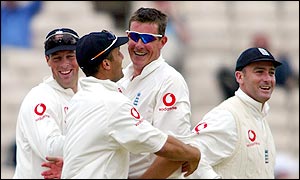 Team-mates swarm Giles