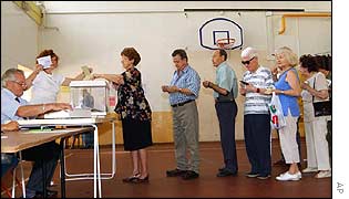 Voters queue in a Marseilles gymnasium
