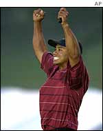 Tiger Woods celebrates his eighth major